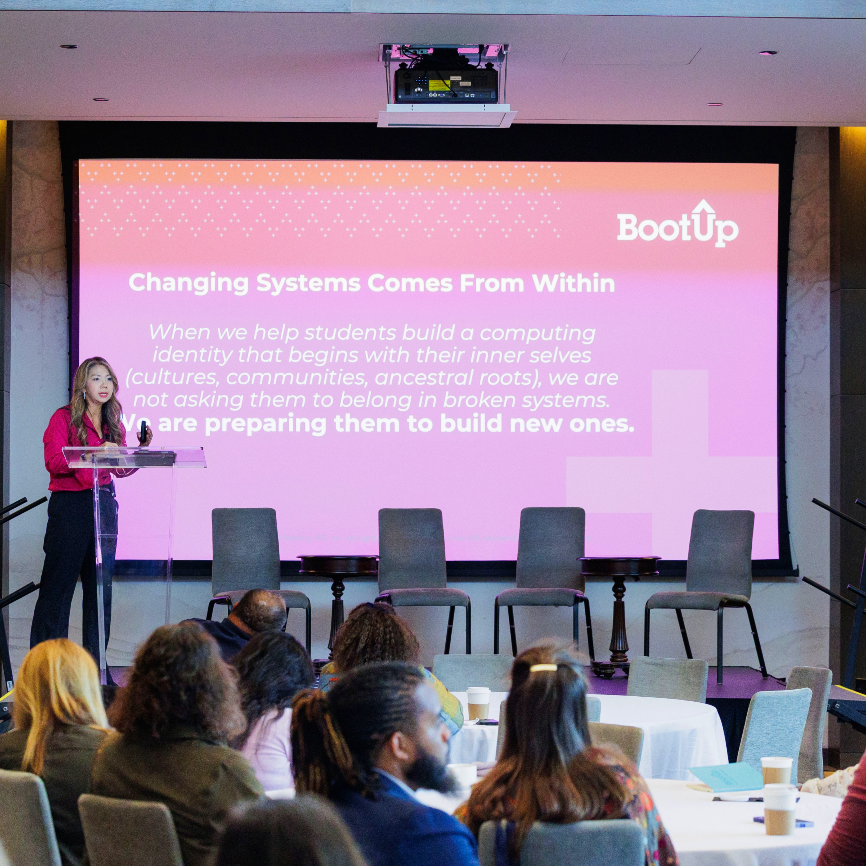 BootUp CEO Lien Diaz presenting to a crowd of educators and researchers at the BootUp Summit in 2025